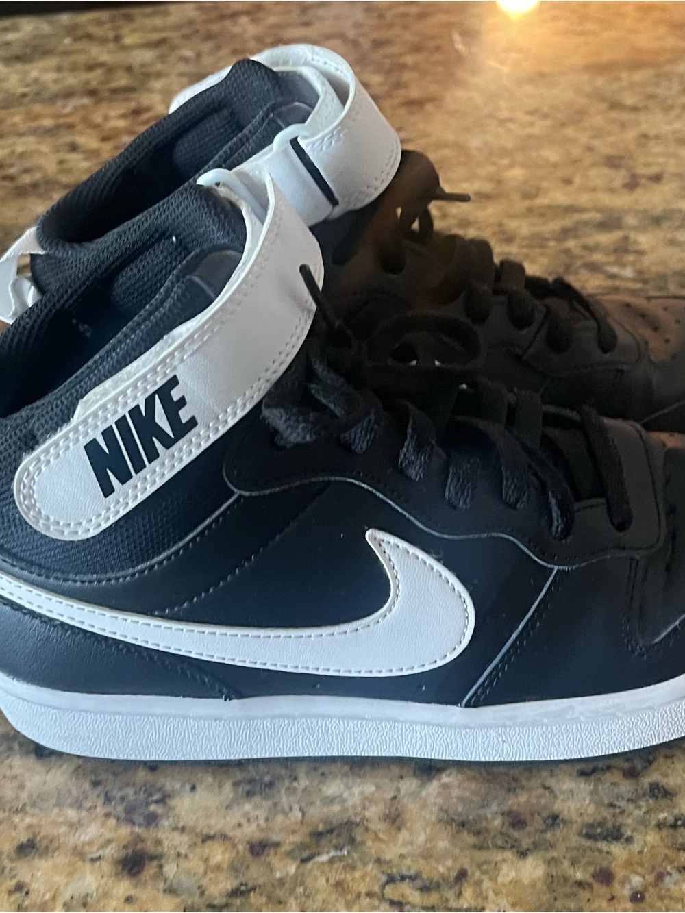 Nike Black and White Mid-Top Sneakers with Signature Swoosh